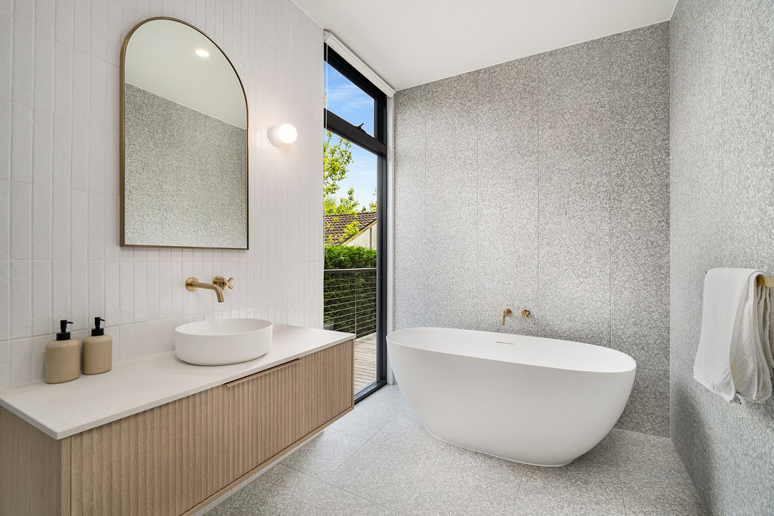 luxurious livability featuring heated polished concrete floors, recycled brickwork, Silvertop Ash external cladding 