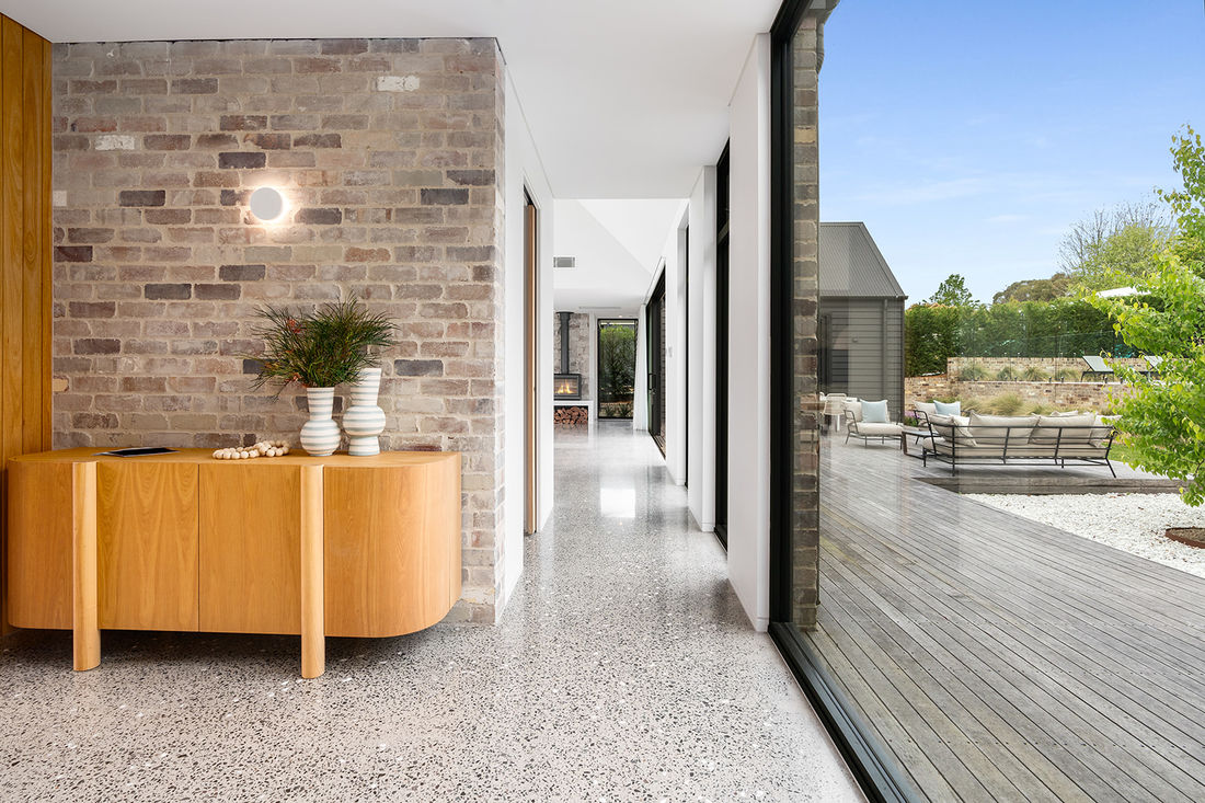 luxurious livability featuring heated polished concrete floors, recycled brickwork, Silvertop Ash external cladding 