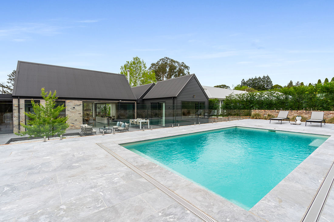 luxurious livability featuring heated polished concrete floors, recycled brickwork, Silvertop Ash external cladding 
